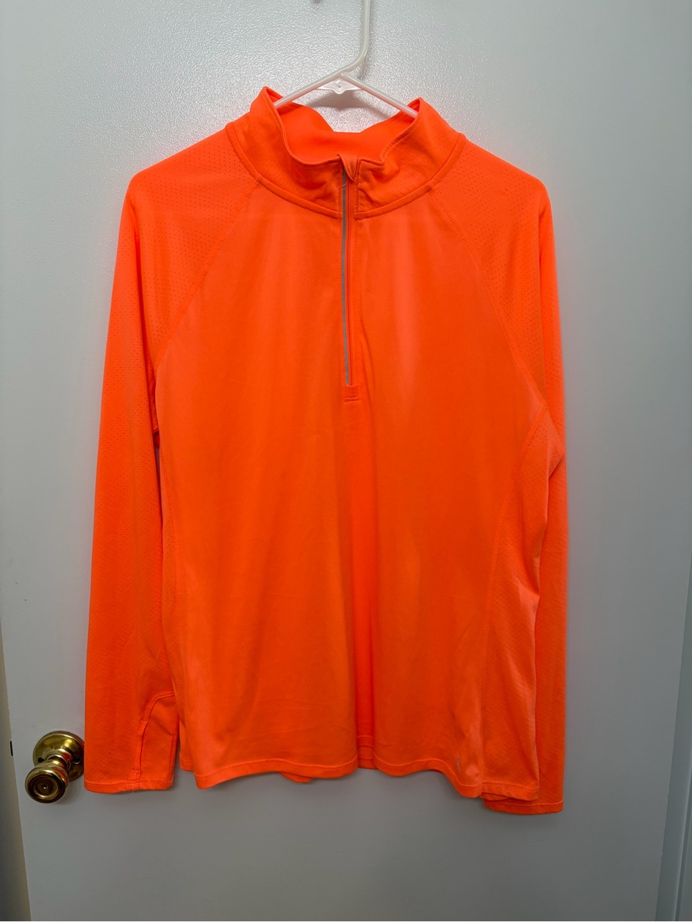 Danskin Now neon Coral Color Athletic Half-Zip Pullover with reflective notes.